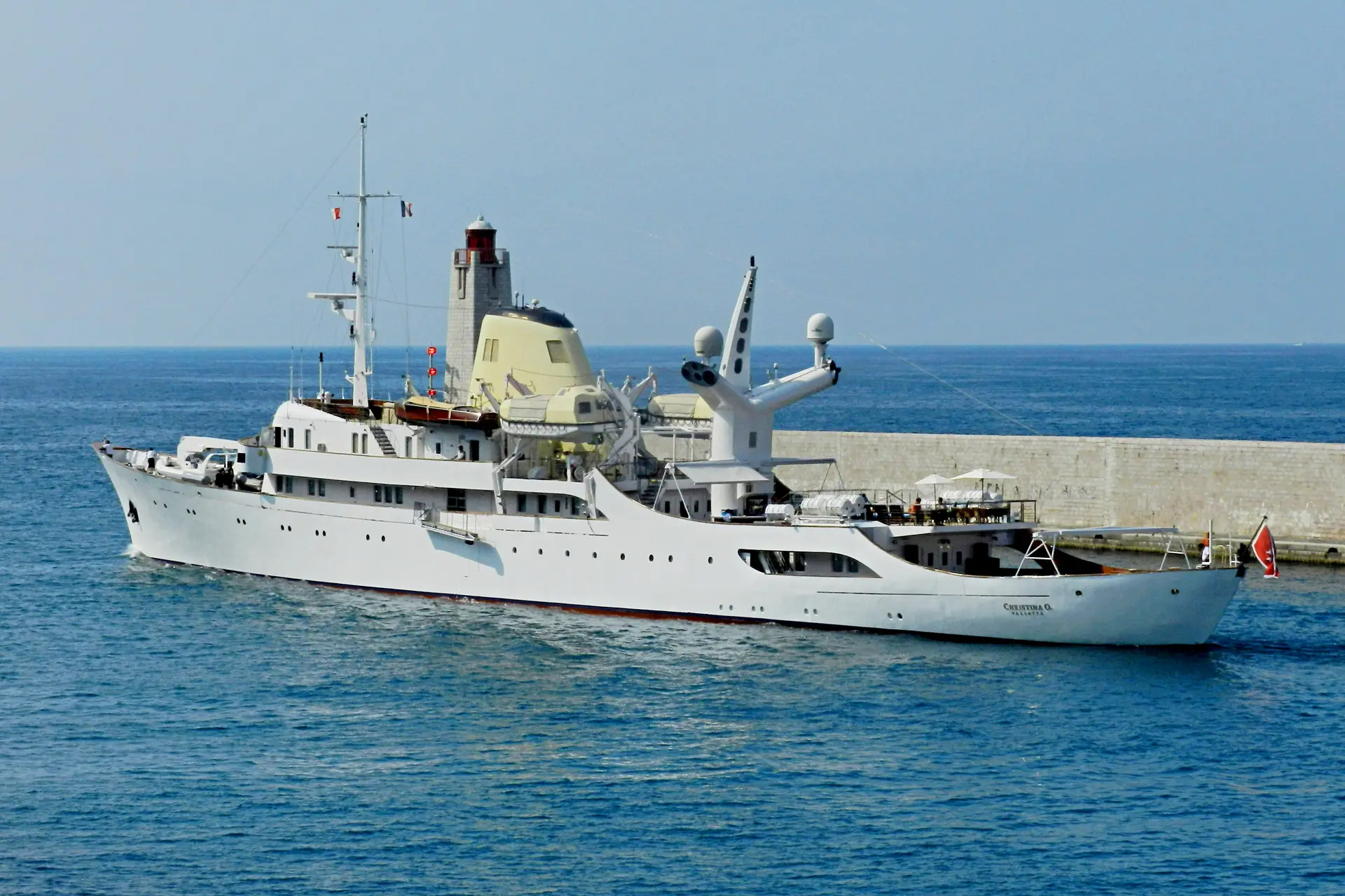 CHRISTINA O entering harbour past a stone breakwater
